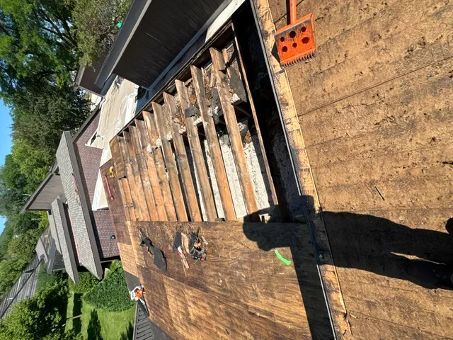 Roof decking replacement with new wood sheathing and exposed framing structure