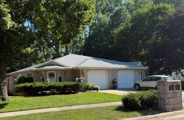 New gray asphalt shingle roof on single-story ranch home with gable design